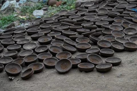 Hands of a potter at work. Potter making ceramic mug on the pottery wheel Stock Photos