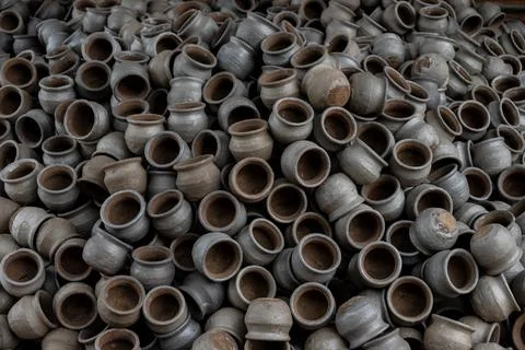 Hands of a potter at work. Potter making ceramic mug on the pottery wheel Stock Photos