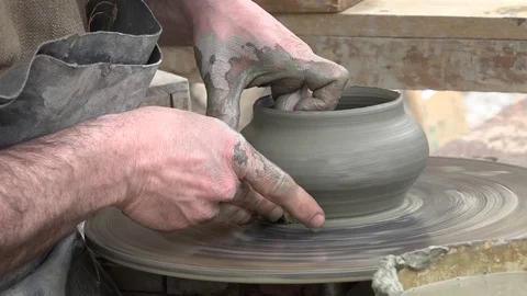 The hands of a potter at work, while creating a vase. Stock Footage 70367563