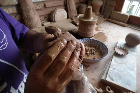 Hands of potter, working with clay, Stock Photos