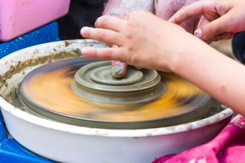 Hands of a potter's wheel Stock Photos