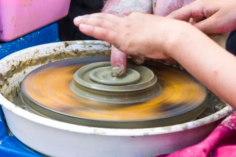 Hands of a potter's wheel Stock Photos