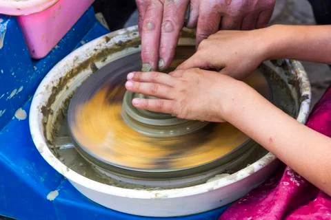Hands of a potter's wheel Stock Photos