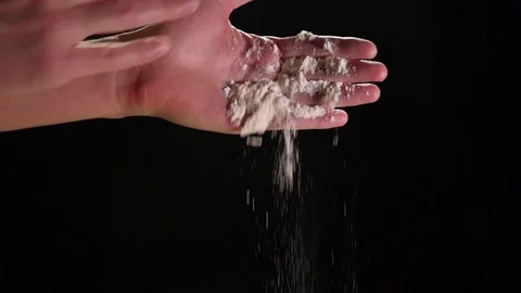 Hands Pouring Flour and Clapping In Slow Motion on Black Background Stock Footage 82149399