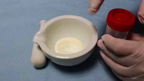 The hands   pours  medicines into the flask . Stock Footage 78507682