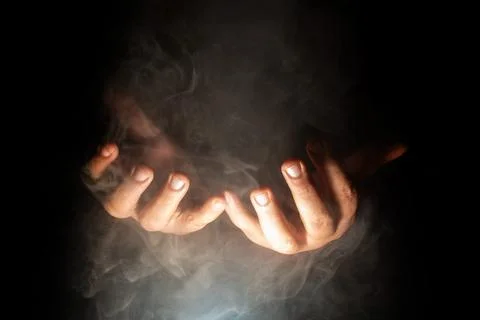 Hands in prayer, Hands of a person in prayer with a rosary in a dark and sm.. Foto stock
