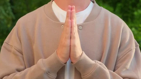 Hands in a prayer positong. Man doing a prayer. Close up of a person holdin.. Stock Footage 339547280
