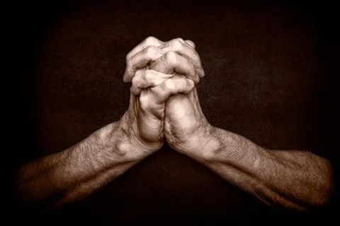 Hands of Praying Man Stockfoto's