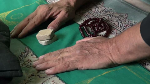 Hands of a praying Muslim man inside a mosque in Qom city in Iran Middle East Video stock 33639888
