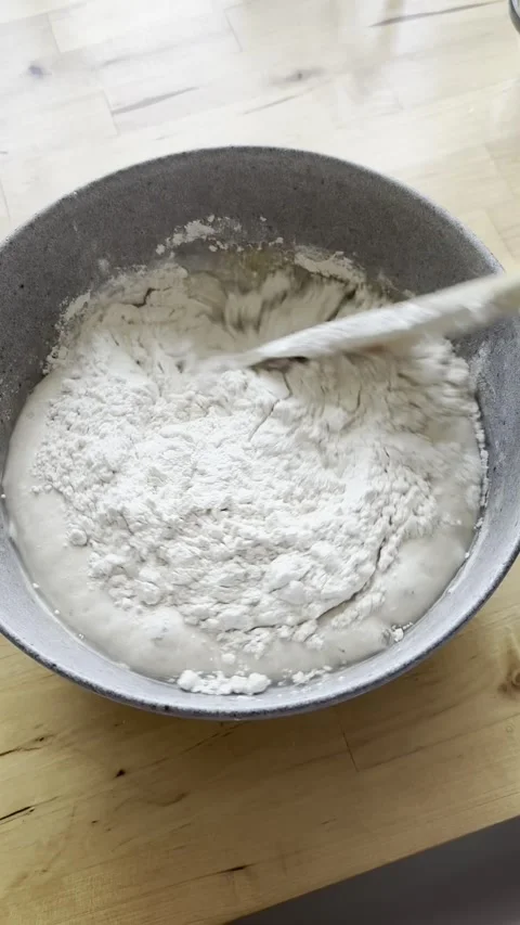Hands preparing bread dough on wooden table. Stock Footage 292341793