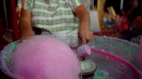 Hands preparing cotton candy in the mill Stock Footage 295457987