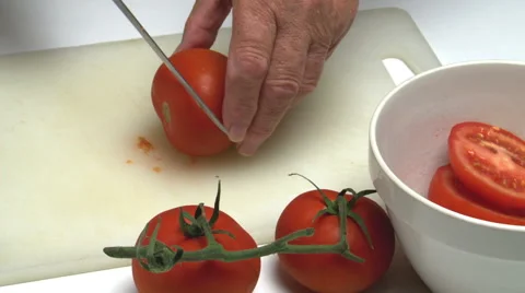 Hands preparing fresh tomatoes, red, white, green. Food Stock Footage 40341620