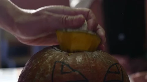 Hands preparing a Halloween pumpkin. Stock Footage 234236867