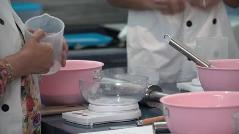 Hands Preparing Ingredients in a Kitchen Stock Footage 317472395