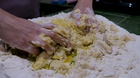 Hands preparing kneading of flour, water and eggs Stock Footage 135152686