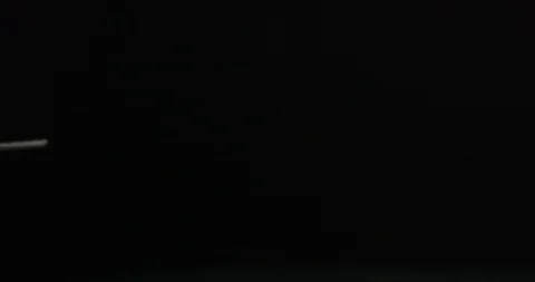 Hands preparing large syringe, black background Stock Footage 105434915