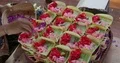 Hands preparing little baskets with Bali Hindu style flower decoration 4k or 4k+ Resolution