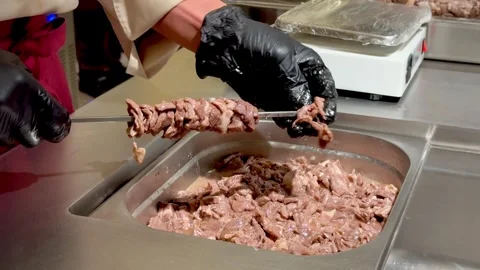 Hands Preparing Meat Skewers in Kitchen Video stock 334627236