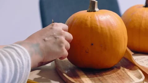 Hands Preparing Pumpkin for Halloween Jack O Lantern Stock Footage 342281385