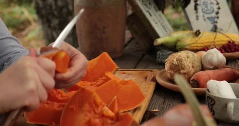 Hands preparing raw pumpkin for cooking and peel off with knife Stock Footage 165289365