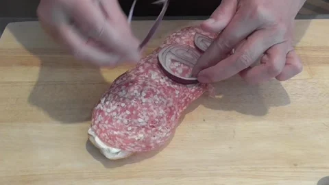 Hands Preparing Salami and Cheese Toast on Wooden Board Stock Footage 345227311