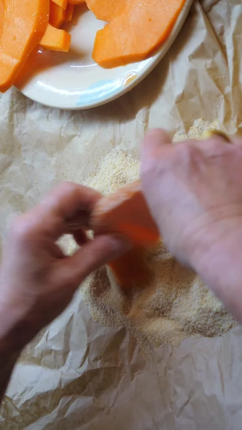 Hands preparing sliced pumpkin for a traditional Italian gratin Stock Footage 305264257