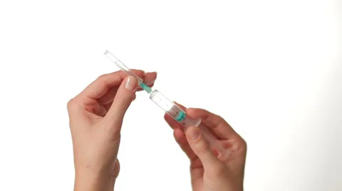 Hands Preparing Syringe on white background Video stock 27118790
