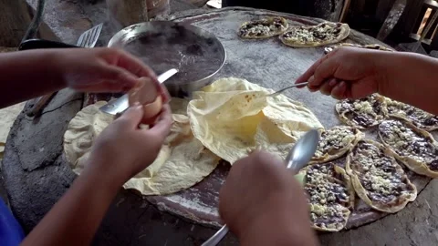 Hands Preparing Traditional Flatbread on Rustic Cooking Surface in Kitchen Stock Footage 337278598
