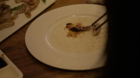 Hands Preparing Traditional Pancake Wrap with Sliced Meat at Beijing Restaurant Stock Footage 345763758