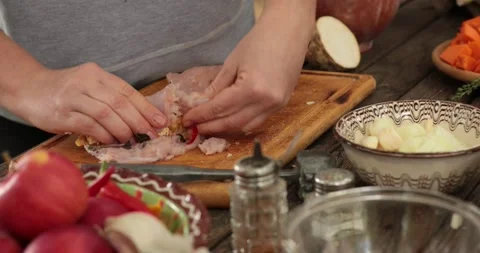 Hands preparing turkey rolls stuffed with cheese and herbs for Thanksgiving Day Stock Footage 165121423