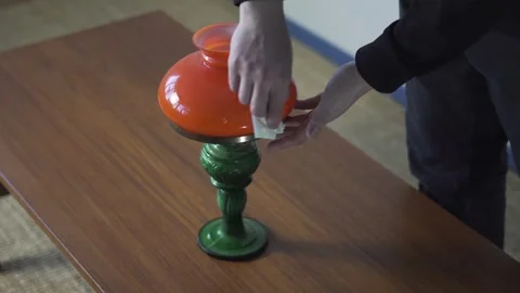 Hands Preparing Vintage Table Lamp for Sale on Wooden Table Stock Footage 334012850
