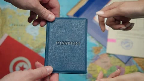 Hands present Tunisian passport to border officer during customs control with Stock Footage 331261945