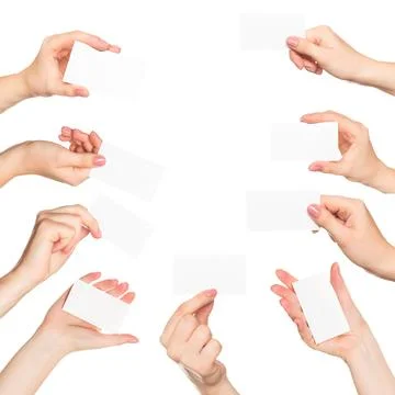 Hands presenting blank cards against a plain white background in a creative Stock Photos