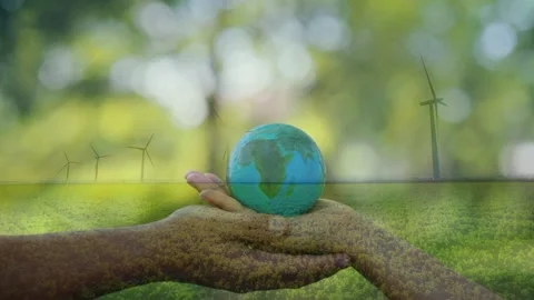 Hands Presenting Globe Over Wind Farm Stock Footage 336479285