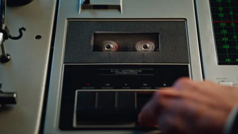 Hands pressing rewind button on old sound recorder closeup. Unrecognizable man Video stock 332619057
