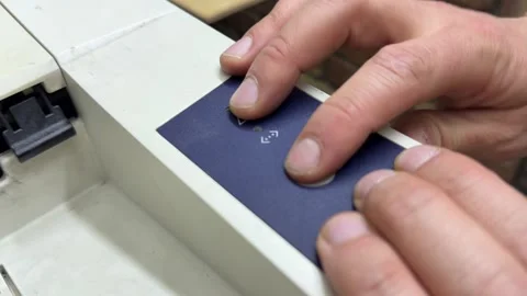 Hands pressing start button on office printer control panel, document processing Stock Footage 337121657