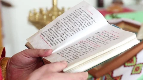 Hands of priest reading the Bible Stock Footage 73152689