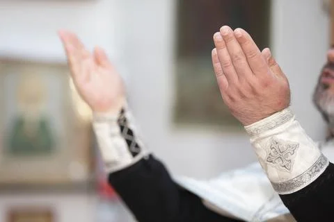 Hands of priests during mass Stock Photos