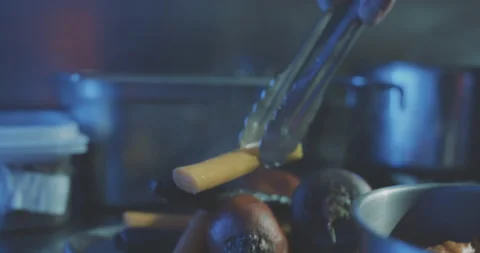 Hands of professional chef putting steaming vegetables to plate Stock Footage 203559001