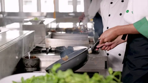 Hands of professional chef show cooking vegetable Asian food on frying pan,.. Stock Footage 245132544