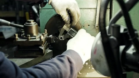 Hands of a professional craftsman use a caliper to measure the diameter on a Stock Footage 285643738