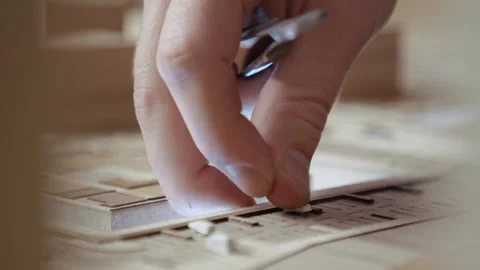 Hands of Professional Man Constructing Architecture Model of Urban Town Building Stock Footage 307804746