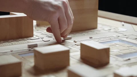 Hands of Professional Man Constructing Architecture Model of Urban Town Building Stock Footage 318120252
