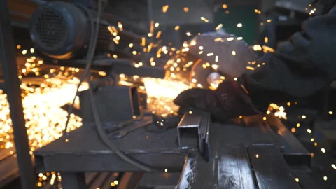 Hands of professional worker grinding metal. Circular saw Stock Footage 310087403