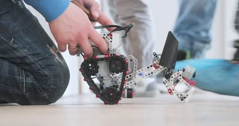 Hands program the robot dog side view Stock Footage 111571118