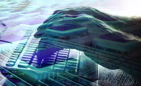 The hands of a programmer are typing a code on a computer keyboard against th 스톡 사진