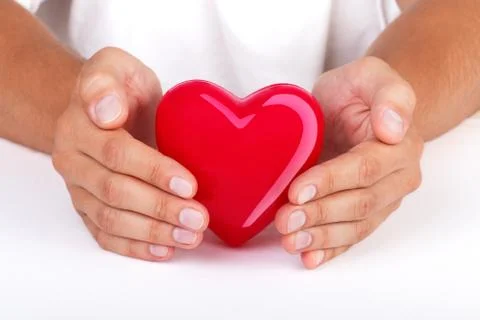 Hands protecting heart Stock Photos