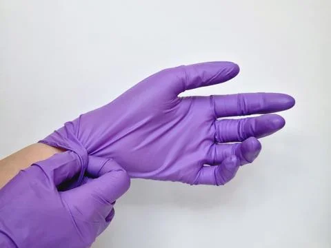 Hands in protective gloves Stock Photos