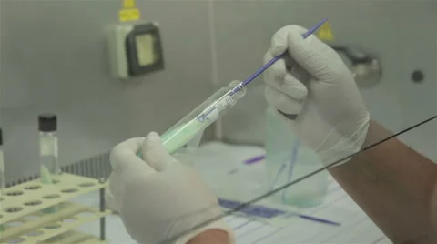 Hands with protective gloves using test tubes, tuberculosis analysis, close up. Stock Footage 50262273