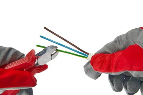 Hands in protective gloves with wire cutters and cable isolated on white Stock Photos
